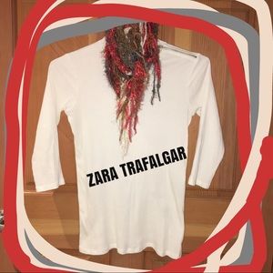 Add PIZAZZ to your look w/ a shoulder-zippered top